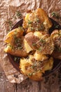 Australian new crash hot potatoes with thyme and cheese close-up. vertical top view