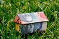 Australian Origami Money House on Lawn Royalty Free Stock Photo