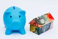 Australian Origami Money House with Piggy bank Royalty Free Stock Photo