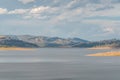 Australian outback landscape with lake and distant hills