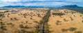 Australian outback and rural road with mountains. Royalty Free Stock Photo