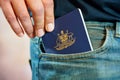 Australian passport in jeans pocket.