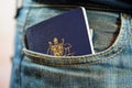 Australian passport in jeans pocket.