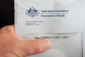 Australian person receiving or delivering a letter from the Austral