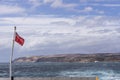 The Australian Red Ensign waving on the ferry that connects Cape Jervis to Penneshaw, Kangaroo Island, Southern Australia