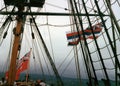 Australian red ensign and Hawaiian National Flag flying aboard a replica 18th century ship anchored in Kona, Hawaii