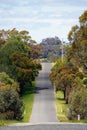 Australian road landscape with trees, a natural blue sky and beautiful colors in Victoria, Australia.