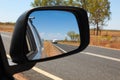 Australian road trip - View is side mirror in Central Queensland Royalty Free Stock Photo