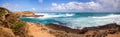 A panorama of rocky ocean views. Yellow sands and rocks. The Azure Ocean. Blue sky. Rock formations at coastline, Great Ocean Road Royalty Free Stock Photo