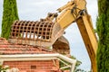 Australian suburban house demolition by excavator