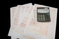 Australian tax forms with pen and calculator on black background. View from above. Tax concept. Financial document. Tax time Royalty Free Stock Photo