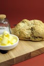 Australian traditional damper bread with butter curls and sea salt vertical. Royalty Free Stock Photo