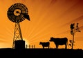 Australian windmill and cows in the outback of Australia