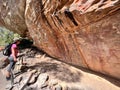 Australian woman look at Indigenous Australian rock art painting Cape York peninsula Queensland Australia