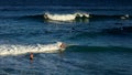 Australian young man and lady surfing at Tamarama beach in Sydne