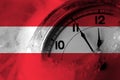 Austria, Austrian flag with clock close to midnight in the background. Happy New Year concept Royalty Free Stock Photo