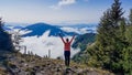 Austria - Girl rising her hands up, freedom while hiking