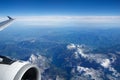 AUSTRIA - October 2016: The alps as seen from an airplane, wing view with plane turbine or engine Royalty Free Stock Photo