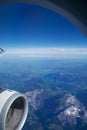 AUSTRIA - October 2016: The alps as seen from an airplane, wing view with plane turbine or engine Royalty Free Stock Photo