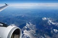 AUSTRIA - October 2016: The alps as seen from an airplane, wing view with plane turbine or engine Royalty Free Stock Photo