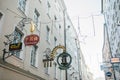 Austria, Salzburg, January 1, 2017: Advertising signs of shops on Getreidegasse street. A picturesque street in the old