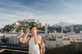 Austria. Salzburg. A young tourist girl takes pictures Royalty Free Stock Photo