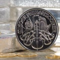 Austria Silver Coin with silver bars & gold coins Royalty Free Stock Photo