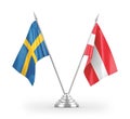 Austria and Sweden table flags isolated on white 3D rendering Royalty Free Stock Photo