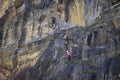 6/07/2020 - Austria Three ferrata climbers try to climb a rock along Stausee Mooserboden dam in Austrian resort of Kaprun in Zell