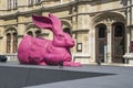 Pink young Durer hare statue next to next to the Vienna State Opera building in Vienna to honer Royalty Free Stock Photo