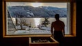 Austria - A young man in an alpine sauna wirh the view on the lake an the mountans