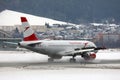 Austrian Airlines plane taxiing on Innsbruck Airport, INN Royalty Free Stock Photo