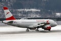Austrian Airlines plane taxiing on Innsbruck Airport, INN Royalty Free Stock Photo