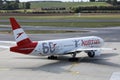 Austrian Airlines plane, 60 years Livery taxiing to terminal