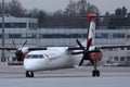 Austrian Airlines plane taxiing in Innsbruck Airport, INN snow Royalty Free Stock Photo