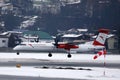 Austrian Airlines plane landing on Innsbruck Airport, INN snow in winter Royalty Free Stock Photo