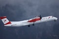 Austrian Airlines plane approaching Innsbruck Airport, INN snow Royalty Free Stock Photo
