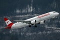 Austrian Airlines plane taking off from Innsbruck Airport Royalty Free Stock Photo