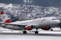 Austrian Airlines plane taking off from Innsbruck Airport Royalty Free Stock Photo