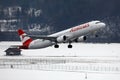 Austrian Airlines plane taking off from Innsbruck Airport Royalty Free Stock Photo