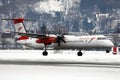 Austrian Airlines plane taking off from Innsbruck Airport Royalty Free Stock Photo