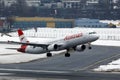 Austrian Airlines plane taking off from Innsbruck Airport Royalty Free Stock Photo