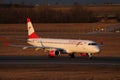 Austrian Airlines plane taxiing, night light Royalty Free Stock Photo