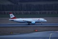 Austrian Airlines plane taxiing, night light Royalty Free Stock Photo