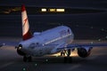 Austrian Airlines plane taxiing, night light Royalty Free Stock Photo