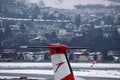 Austrian Airlines plane taxiing in Innsbruck Airport, INN snow in winter, close-up view Royalty Free Stock Photo