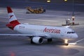 Austrian Airlines plane taxiing, night light Royalty Free Stock Photo
