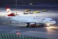 Austrian Airlines plane taxiing, night view Royalty Free Stock Photo