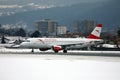 Austrian Airlines plane in Salzburg Airport, snow in winter Royalty Free Stock Photo