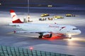 Austrian Airlines plane taxiing in Vienna Airport, VIE, night Royalty Free Stock Photo